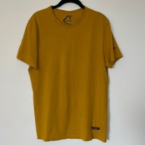 Mustard colored T-shirt from Being Human